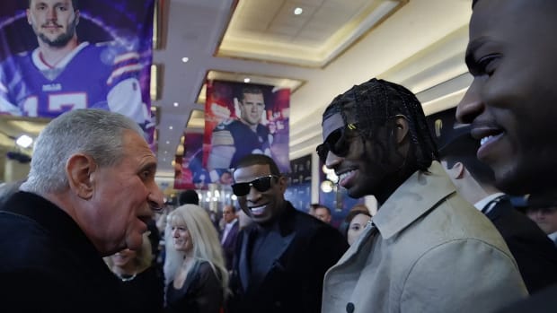 Sanders family with Atlanta Falcons owner Arthur Blank at NFL Honors
